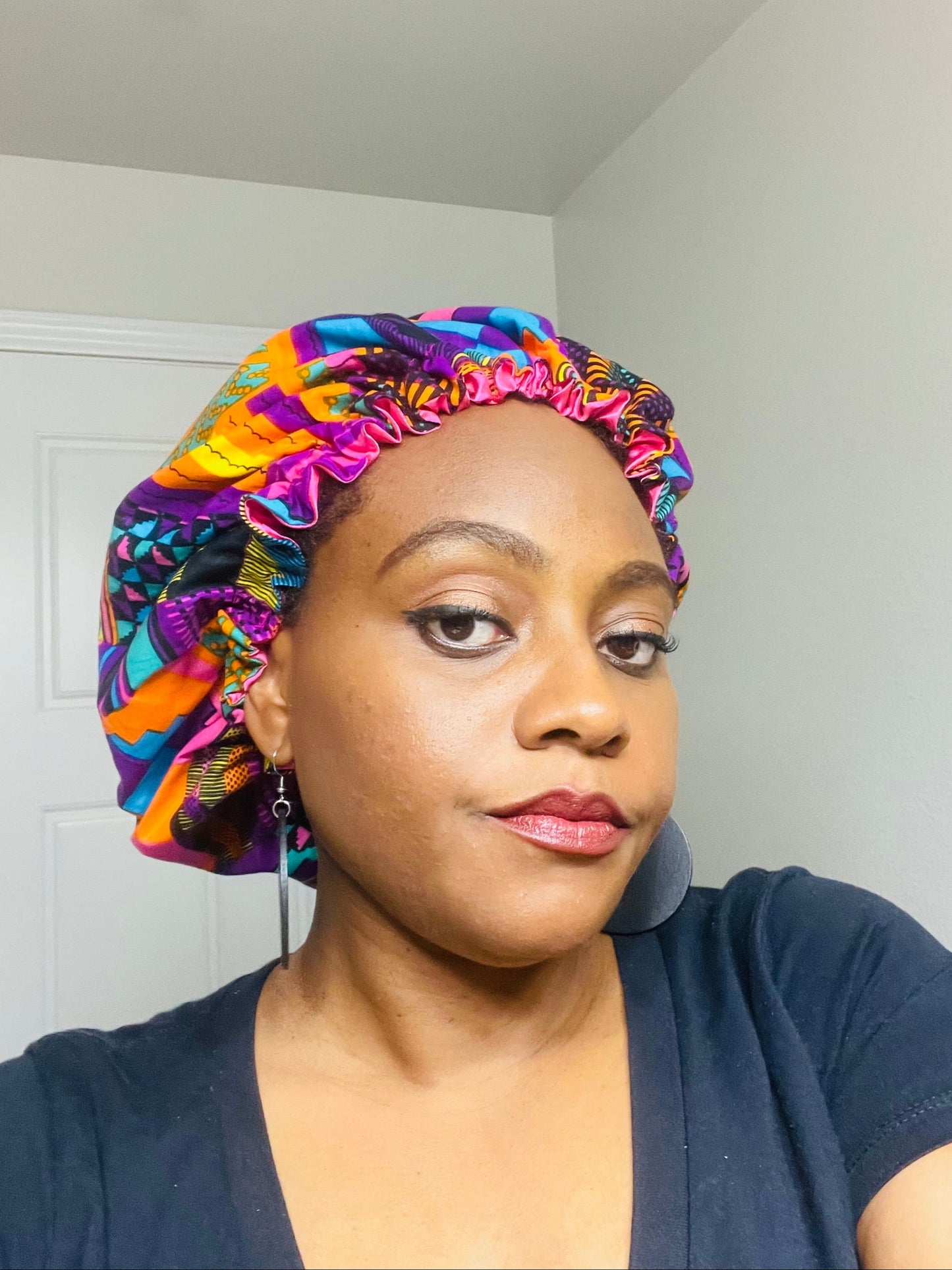 Person wearing a colorful headscarf